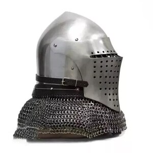 May include: A polished steel medieval helmet with a riveted visor and a leather strap. The helmet features a series of small holes for ventilation and is attached to a chainmail coif. The design is reminiscent of historical armor.