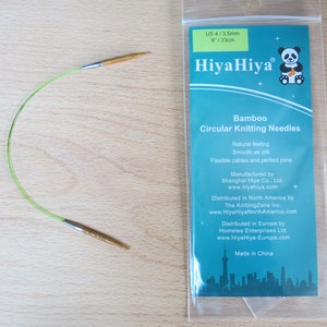 May include: A set of green HiyaHiya bamboo circular knitting needles, size US 4/3.5mm or 9/23cm. The needles are packaged in a clear plastic bag with a label that includes the brand name, product description, and manufacturing information.