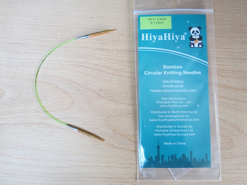 May include: A set of green HiyaHiya bamboo circular knitting needles, size US 4/3.5mm or 9/23cm. The needles are packaged in a clear plastic bag with a label that includes the brand name, product description, and manufacturing information.