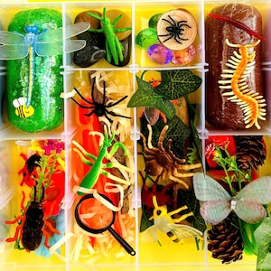 May include: A white ceramic mug with a black handle and the text "But First, Coffee" in a black, bold font. The mug is sitting on a wooden surface. The mug is approximately 4 inches tall.