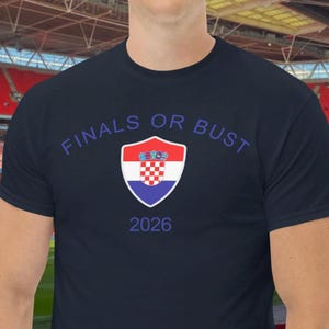 May include: A navy blue t-shirt with the text "Finals or Bust 2026" and a Croatian flag shield.