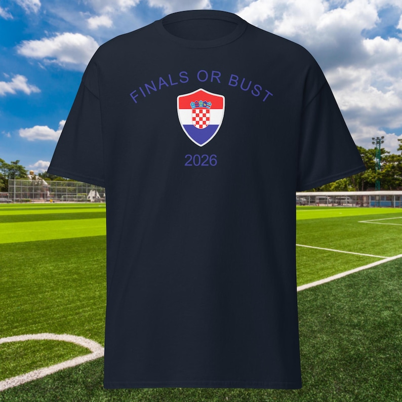 May include: A navy blue t-shirt with the text "Finals or Bust" and a Croatian coat of arms in a shield. The year 2026 is printed below the shield.
