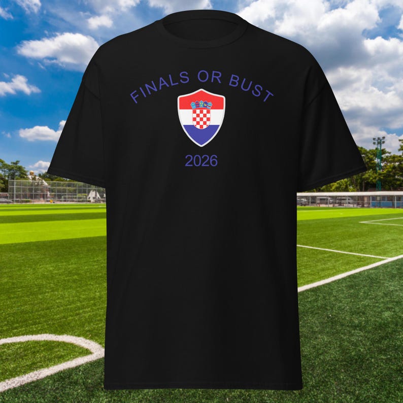 May include: Black t-shirt with the text "FINALS OR BUST" in white and a blue and red shield with the Croatian flag inside. The year 2026 is printed below the shield.