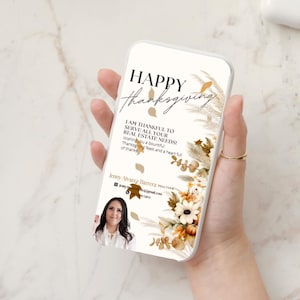 May include: A smartphone case with a Thanksgiving design. The case features the words "HAPPY Thanksgiving" in elegant script, along with floral and leaf accents in warm tones. The text "I am thankful to serve all your real estate needs!" is also included.
