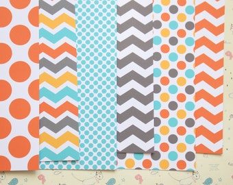 May include: A set of six patterned scrapbook papers. The papers feature a variety of patterns, including polka dots, chevron, and stripes. The colors are orange, yellow, blue, and gray.