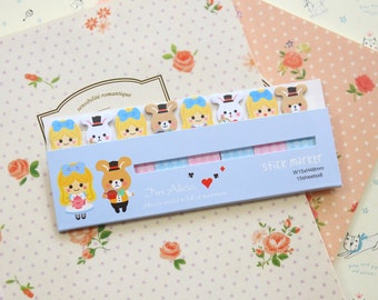 May include: A set of colorful sticky notes featuring Alice in Wonderland characters. The notes are blue, pink, and white with illustrations of Alice, the Mad Hatter, and the Cheshire Cat. The notes are labeled "Stick Marker" and "Tim Alice".