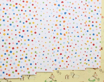 May include: Six sheets of white paper with different colorful patterns. The patterns include squares, circles, stars, hearts, and triangles.