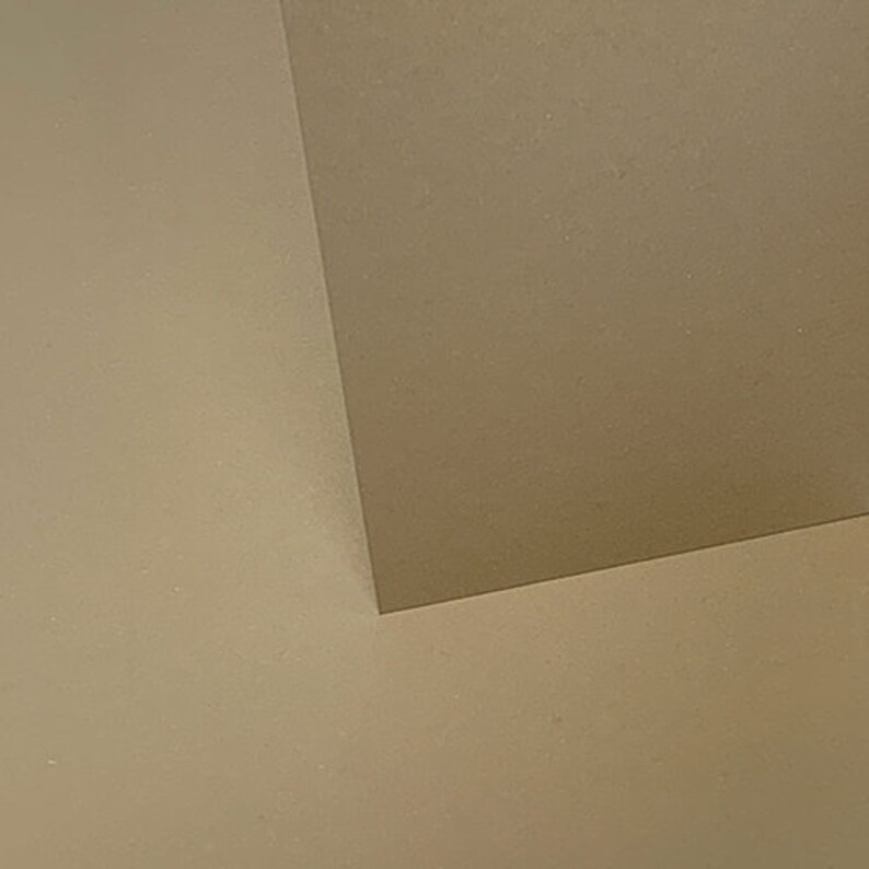 May include: A close-up of a corner where two walls meet. The walls are painted a light beige color.