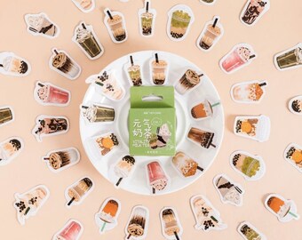 May include: A set of 30 colorful stickers featuring various bubble tea designs. The stickers are arranged in a circle around a small box of tea. The box is labeled "Vitality Milk Tea" in English and Chinese.