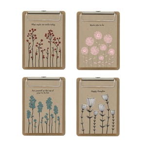 May include: Four clipboards with floral designs and inspirational text. The clipboards have a brown backing and silver metal clips. The text includes "What made me smile today", "Mums jobs to do", "Put yourself at the top of your to do list", and "Happy thoughts".