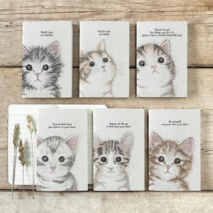 May include: Six small rectangular notecards with kitten illustrations. Each card has a different kitten drawing and a unique message, including "World's best cat mummy" and "Beware of the cat it will steal your heart."