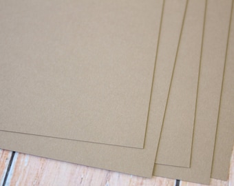 May include: Stack of four brown cardstock sheets. The sheets are smooth and have a subtle texture.