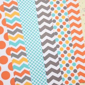 May include: Six strips of patterned paper with different designs. The patterns include orange and white polka dots, gray and turquoise chevron, turquoise polka dots, gray and white chevron, orange, turquoise, and gray polka dots, and orange and white chevron.