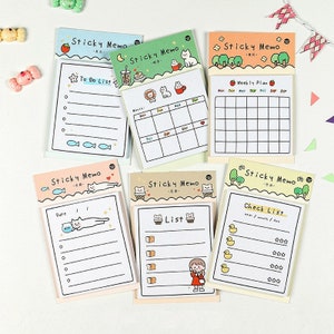 May include: A set of eight colourful sticky note pads with different designs and layouts. Each pad features a cute cartoon animal and a different type of list, including to-do, weekly plan, check list, and more.