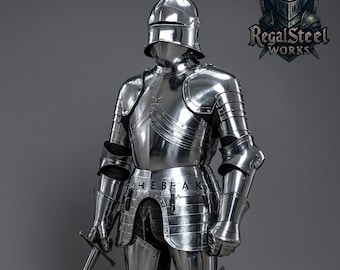 May include: Full suit of polished steel armor, including a helmet, breastplate, and leg guards. The armor is highly reflective, with a sword held in the right hand. The image includes the text "HEBEAK" and the logo "Regal Steel Works".