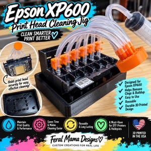 May include: An Epson XP600 print head cleaning jig featuring a black 3D-printed base, orange connectors, and clear tubing attached to a syringe. The device includes text labels like Epson XP600 Print Head Cleaning Jig and Clean Smarter Print Better.