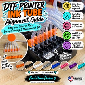 May include: An orange 3D printed DTF printer ink tube alignment guide with a series of slots to hold clear plastic tubing in place. The tool features a rectangular base with vertical dividers and is shown in various colors including black, white, gray, blue, pink, purple, and teal.