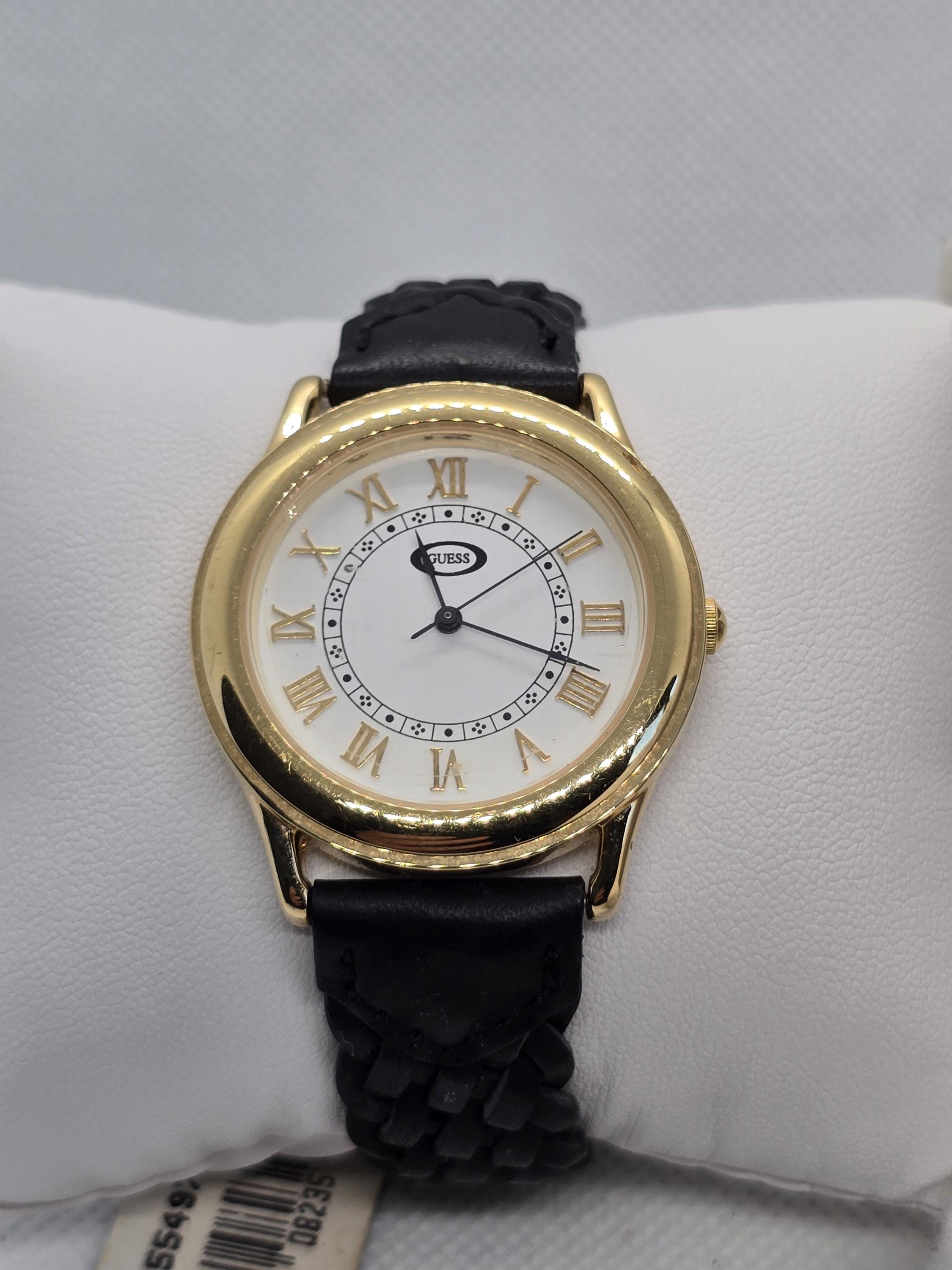 Guess Gold and White Roman Numeral Elegant Watch Amazon.com: Guess Ladies 40mm Watch - White Strap Champagne  main image 4