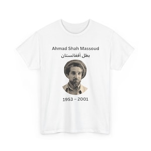 May include: White t-shirt featuring a sepia-toned portrait of Ahmad Shah Massoud, with text above and below the image. The text includes his name in English and Dari, along with the years 1953-2001.