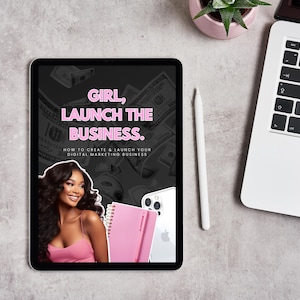 May include: A digital marketing business guide displayed on a tablet. The tablet screen features the text "GIRL, LAUNCH THE BUSINESS." and an image of a woman. A laptop, stylus, and plant are also visible.