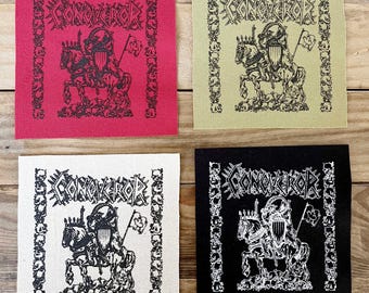 May include: Four square patches featuring the word "CONQUEROR" and a knight on horseback design. The patches are in red, light green, white, and black, with a skull border.