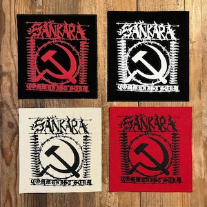 May include: Four square patches with the word "SANKARA" in a distressed font, a hammer and sickle symbol, and the words "COMMUNIST SCUM". The patches are black, white, red, and off-white.
