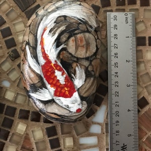 Red and White Koi and Pebbles Rock