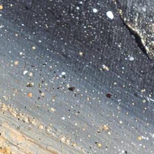 May include: Abstract painting with a textured surface. The artwork features a gradient of colors, including gray, black, and beige, with scattered white and yellow paint splatters. The brushstrokes create a sense of depth and movement.