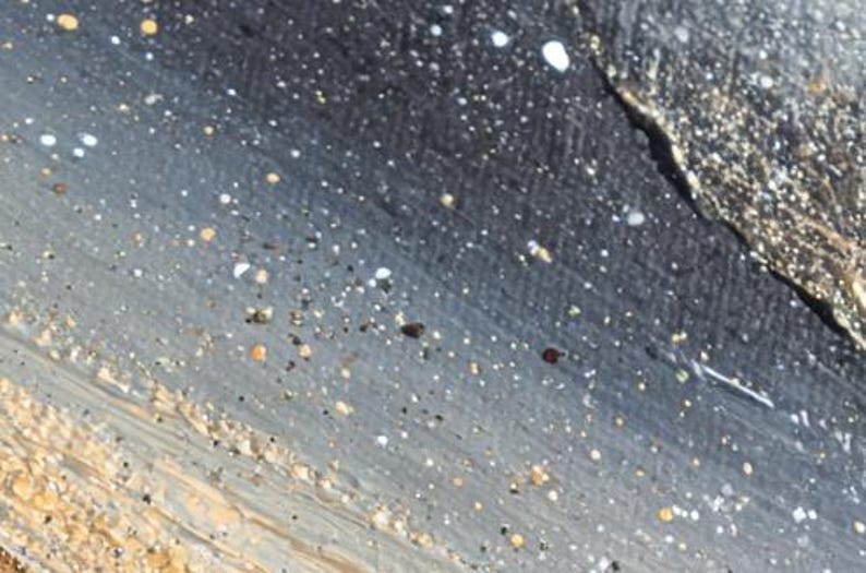 May include: Abstract painting with a textured surface. The artwork features a gradient of colors, including gray, black, and beige, with scattered white and yellow paint splatters. The brushstrokes create a sense of depth and movement.