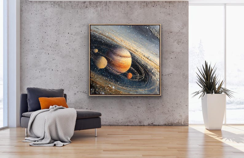 May include: A framed abstract painting of a planet with swirling rings and smaller celestial bodies. The artwork features shades of orange, blue, and gold, creating a cosmic theme. The painting hangs on a textured gray wall.