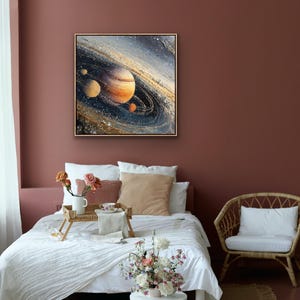 May include: A framed painting of a planet with rings, in shades of orange, brown, and blue, hangs on a maroon wall. The painting is above a bed with white linens, pillows, and a wooden tray with flowers and a cup. A small side table holds a floral arrangement.