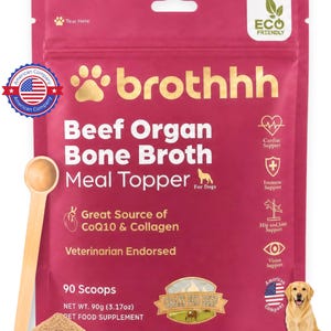 May include: A magenta pouch of brothhh Beef Organ Bone Broth Meal Topper for dogs. The packaging features text including 90 Scoops, Net Wt. 90g (3.17oz), and icons for health support. A wooden scoop and a pile of brown powder are shown next to a dog.