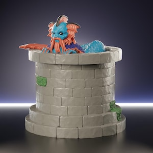 May include: A white ceramic mug with a black handle and the text "But First, Coffee" in a bold, black font. The mug is filled with a dark liquid, likely coffee, and sits on a light-colored surface.