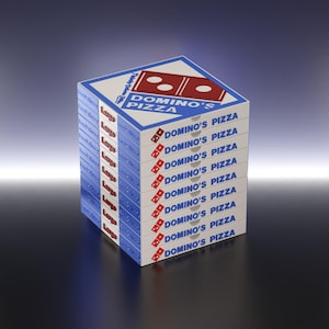 May include: A stack of Domino's Pizza boxes, displaying the Domino's Pizza logo in red and blue. The boxes are white with the words "Domino's Pizza" printed on the sides. The boxes are neatly stacked, indicating a large pizza order.