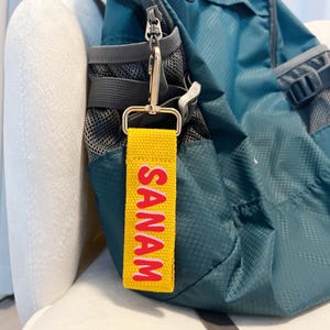 Personlig bagageetikett i bomullsväv: Anpassat namn, sportväskeetikett