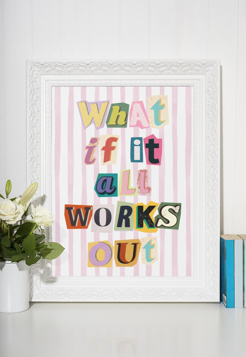 May include: A framed print with a pink and white striped background. The text "What if it all works out" is written in colorful, cut-out letters.