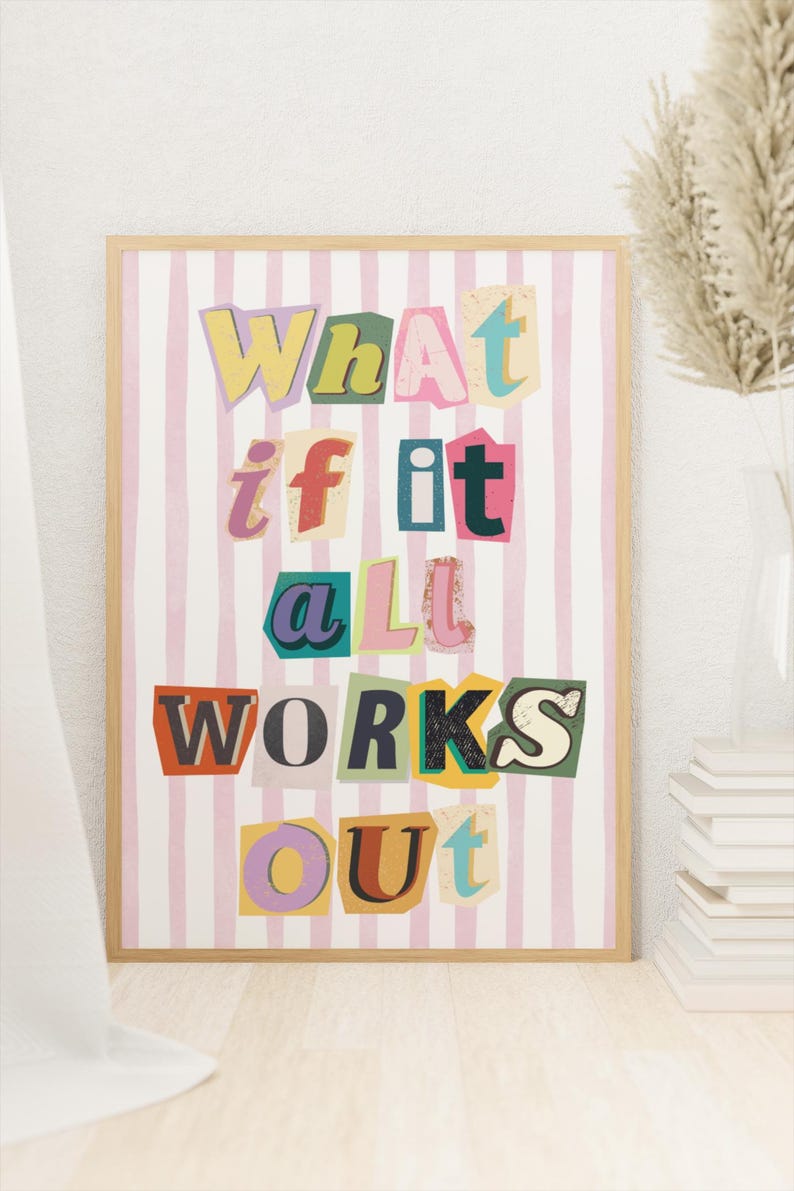 May include: A framed print with a pink and white striped background. The text "What if it all works out" is written in colorful, cut-out letters.
