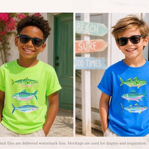 May include: Two children wearing sunglasses and t-shirts with fish designs. One child wears a lime green shirt, the other a blue shirt. The shirts feature three colorful fish illustrations. The background includes beach-themed signage.