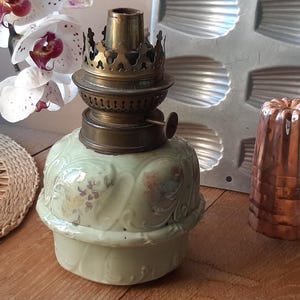 Old vintage earthenware oil lamp for shabby chic decoration