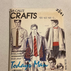 May include: Vintage McCall's Crafts pattern for men's accessories. The cover shows illustrations of men in various outfits, including ties, scarves, and coats. The text "Today's Man" is prominently displayed in blue.