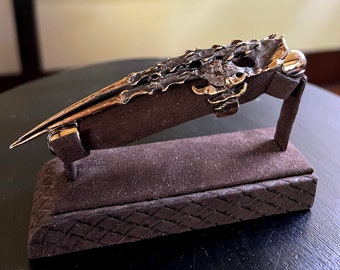 Anillo de garra de diablo de bronce