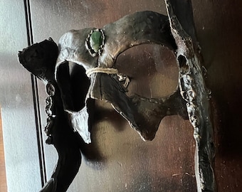 Máscara de cazador de bronce