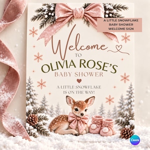 May include: A welcome sign for a baby shower featuring a fawn with a pink bow, knitted booties, and pine branches with snowflakes. The text reads: Welcome to Olivia Rose's Baby Shower, A Little Snowflake is on the way! A large pink bow sits at the top.
