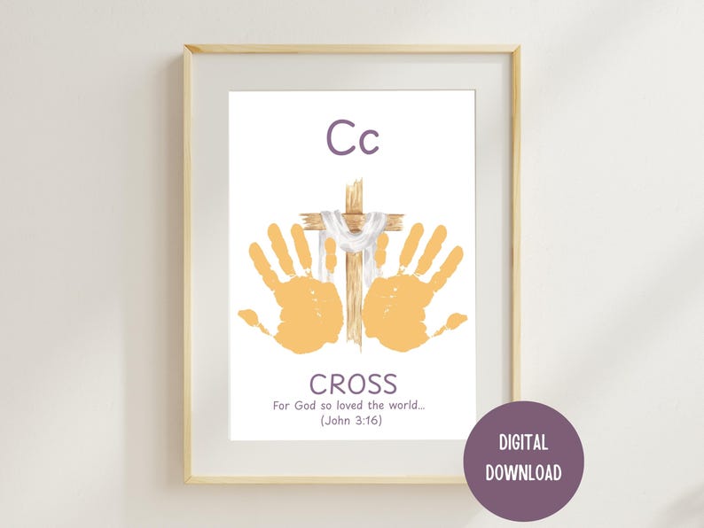 May include: Framed print featuring a wooden cross with a white cloth and two orange handprints. The word "CROSS" is below, with the text "For God so loved the world... (John 3:16)". The letter "Cc" is at the top. A purple circle says "DIGITAL DOWNLOAD".