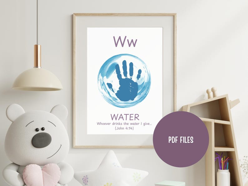 May include: A framed print featuring the letter "Ww" above a blue handprint inside a blue circle, with the word "WATER" below. The print includes a Bible verse and is part of a children's educational series.