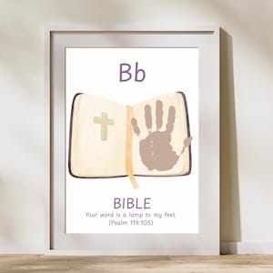 May include: Framed print featuring the letter "Bb" above an open book with a cross and a handprint. The word "BIBLE" is below, along with the quote "Your word is a lamp to my feet. (Psalm 119:105)". The print is in a white frame.