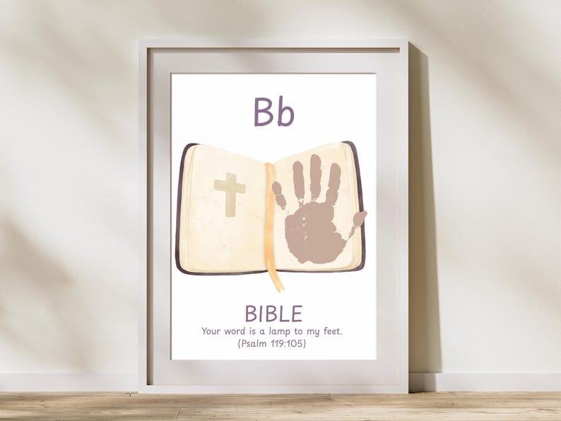 May include: Framed print featuring the letter "Bb" above an open book with a cross and a handprint. The word "BIBLE" is below, along with the quote "Your word is a lamp to my feet. (Psalm 119:105)". The print is in a white frame.