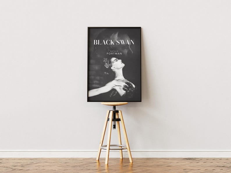 May include: Black and white movie poster for the film "Black Swan" starring Natalie Portman.