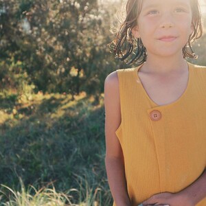 Summer top. Turmeric Paprika. Off centre wood button. Minimalist style. Girls beach top. Yellow top. 100% cotton.