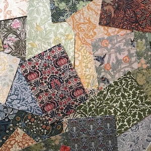 May include: Assortment of patterned paper squares in various colors and designs, including floral, geometric, and abstract patterns. The papers are arranged in a random pattern, creating a visually appealing collage.